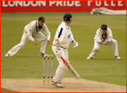 Andrew Strauss catches James Adams as Ben Hutton looks on