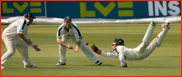 Tom Burrows spills a catch but Shane Warne snatches it up