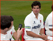 Captain James Foster 'snaps' Alastair Cook, press day, 2011