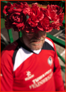 Mike Moore wears his familiar hat of red roses