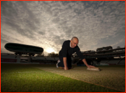 Assistant Head Groundsman, Adrian Morgan, tends to the wicket at sunrise.