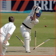 Michael Lumb is bowled by James Tomlinson