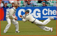 Gareth Batty watches as Steven Peters fields in the slips