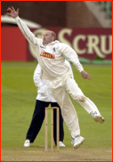 Neil Smith fields off his own bowling
