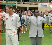 England captain Michael Atherton turns away from President Mugabe.
