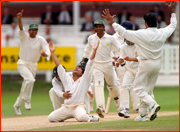 Mushtaq Ahmed celebrates a wicket.